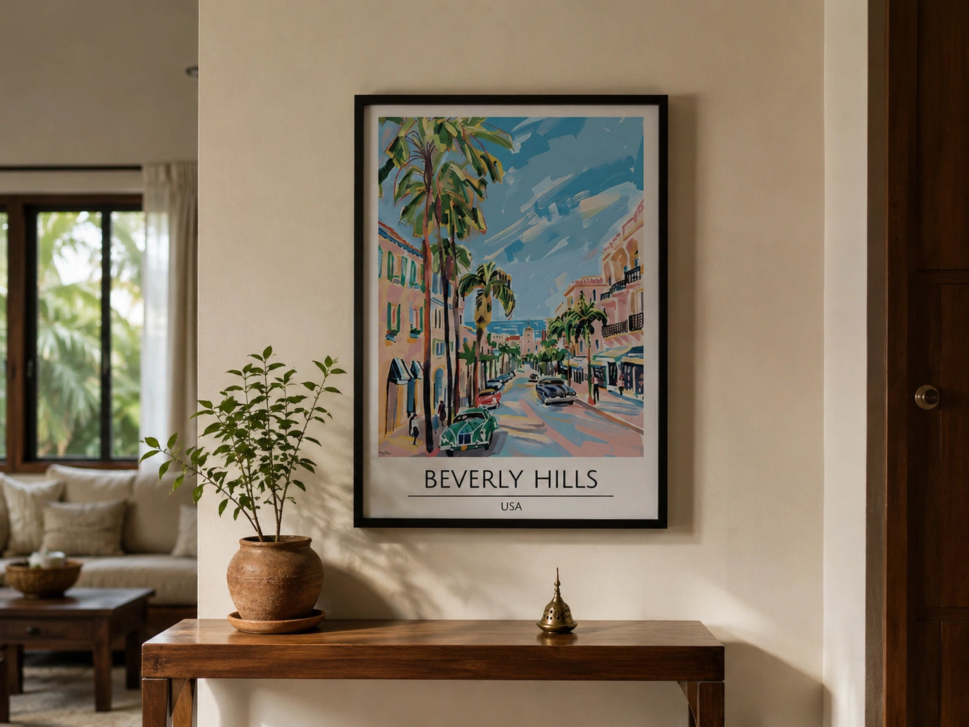 Artwork of beverly hills travel poster above a console in indian home