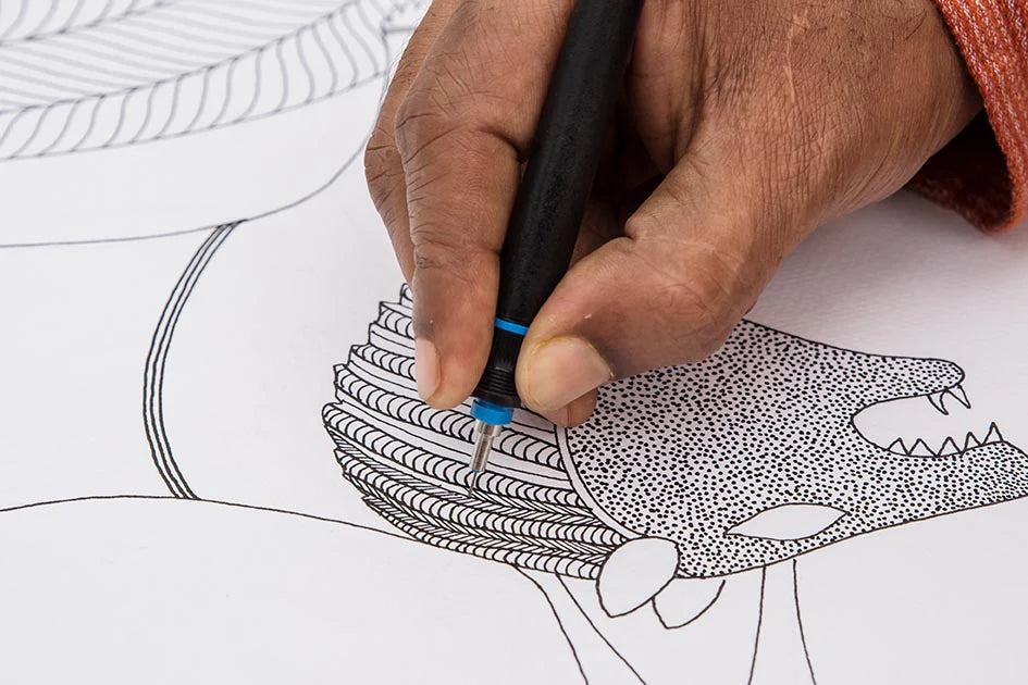 Gond artist creating a Gond painting with detailed patterned linework
